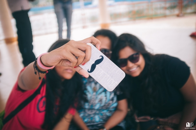 Tourists taking a selfie with an iPhone